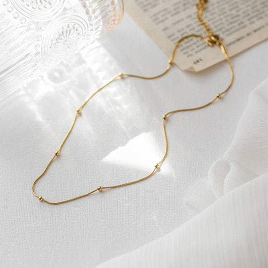 Gold beaded necklace